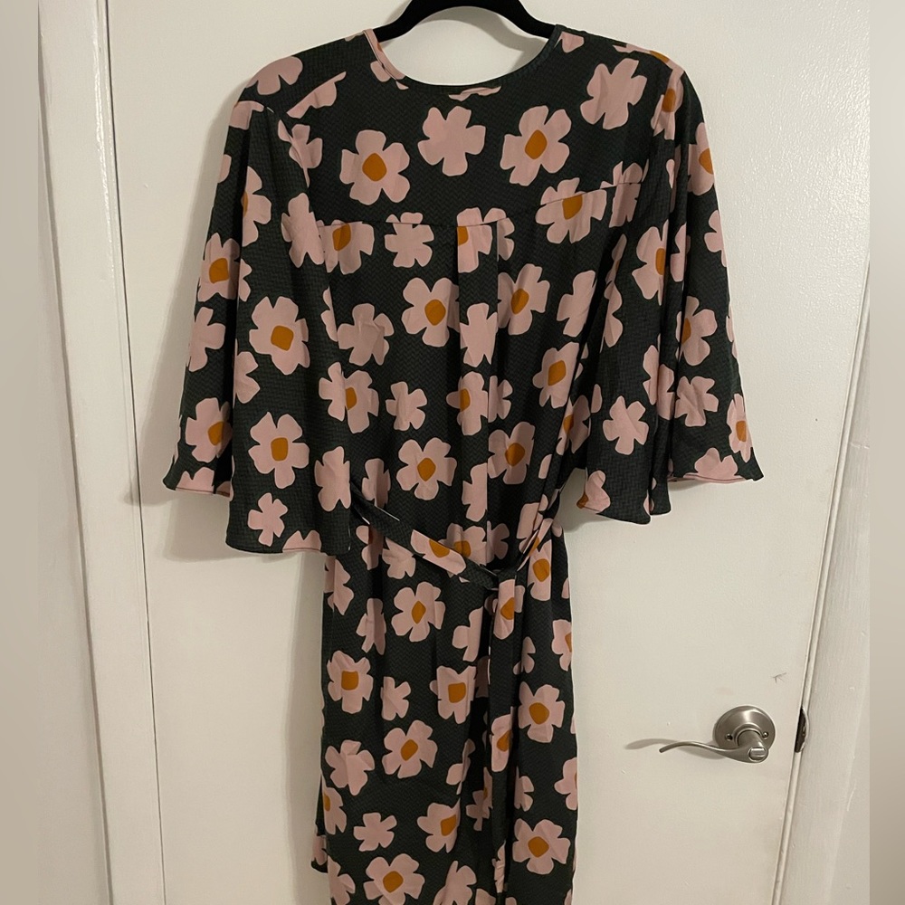 Floral dress. Hits above the knee but is finger length